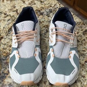 On Running Sneakers with Green and White Accents